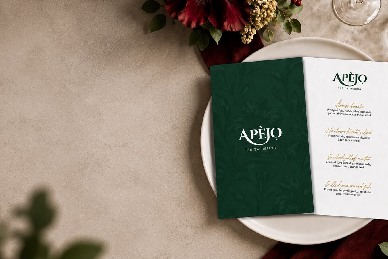 An Apèjọ menu card resting on a plate